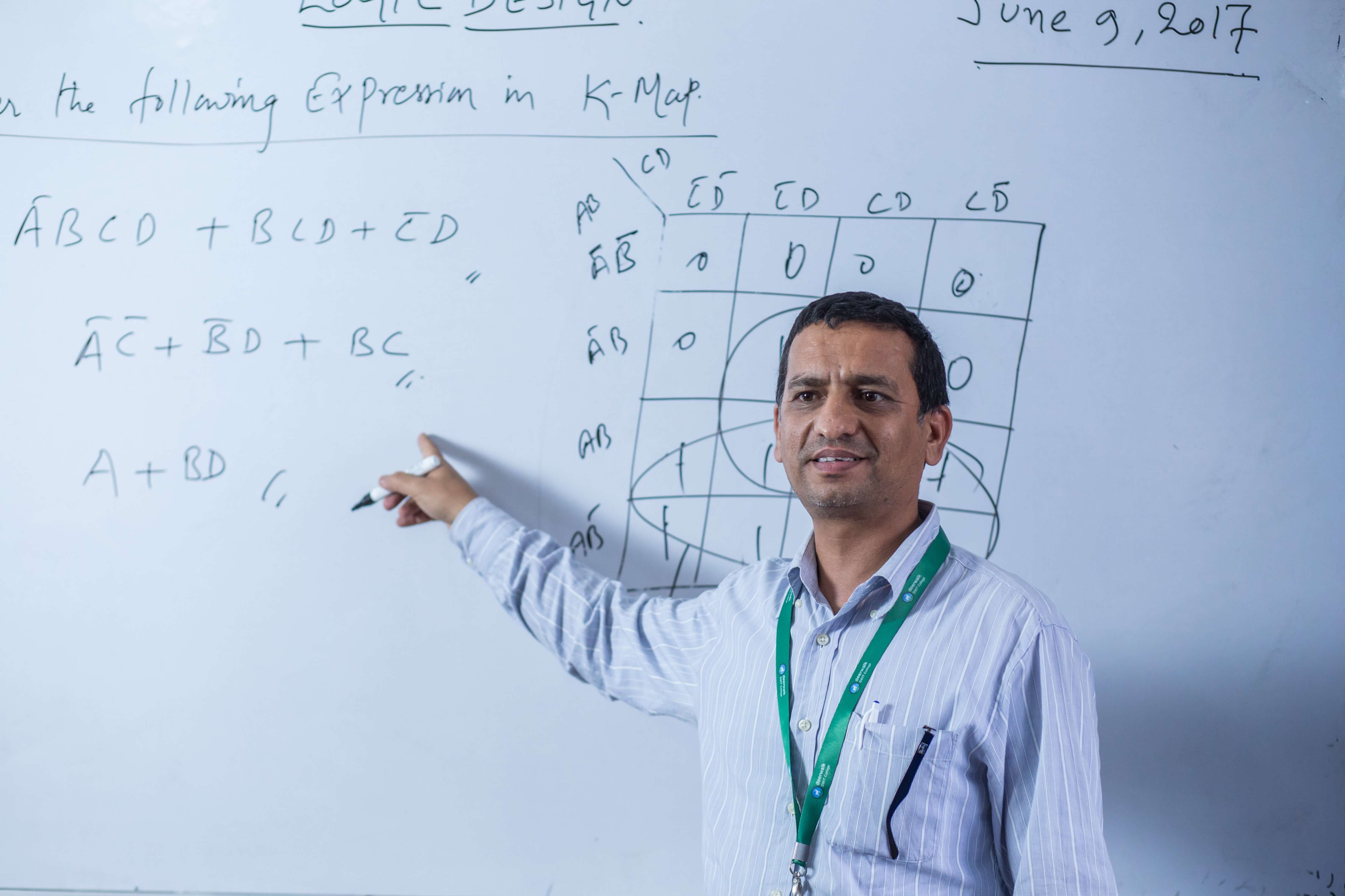 a lecturer at dwit,beside the whiteboard